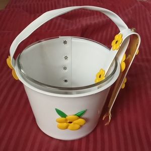 Vintage glass ice bucket with cover and matching tongs.